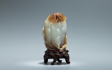 A Chinese celadon and russet jade model of a melon