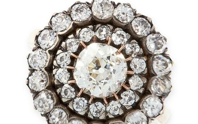 A DIAMOND CLUSTER RING in yellow gold and silver, set