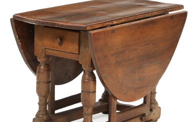 A Danish mid 18th century oak drop leaf table, apron with drawer....