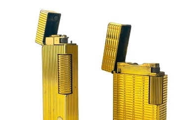 A Dunhill gold plated pocket lighter. Height 6.4cm, together...