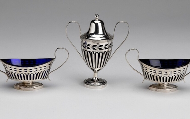 A Dutch silver mustard pot and two salt cellars with blue glass liners, Leiden