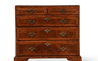 A GEORGE II WALNUT, CROSS BANDED AND FEATHER BANDED CHEST OF DRAWERS, CIRCA 1730