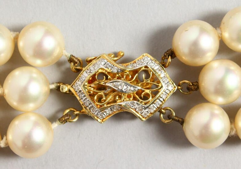 A GOOD TRIPLE-ROW PEARL NECKLACE, with 14CT GOLD CLASP.