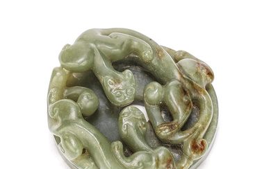 A GREEN AND RUSSET JADE 'DRAGON' SCROLL WEIGHT Qing Dynasty