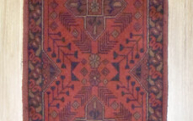 A HANDKNOTTED PURE WOOL AFGHAN KHAL RUNNER