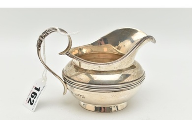 A LATE VICTORIAN CREAM JUG, baluster silver cream jug with a...