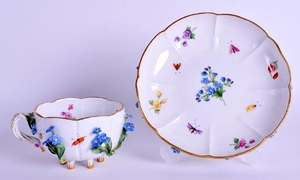 A MEISSEN ENCRUSTED PORCELAIN CUP AND SAUCER encrusted