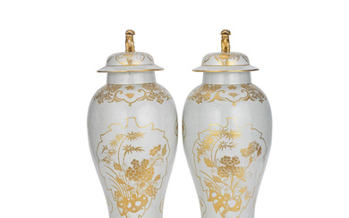 A PAIR OF GILT-DECORATED WHITE ENAMELLED VASES AND COVERS 20th...