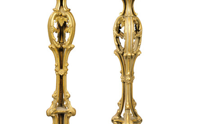 A PAIR OF GREEN-PAINTED AND PARCEL-GILT COMPOSITION TORCHERES, SECOND QUARTER 19TH CENTURY