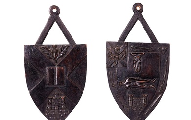 A PAIR OF VICTORIAN CARVED WALNUT SHIELD WALL PLAQUES SCOTTISH, THIRD QUARTER 19TH CENTURY
