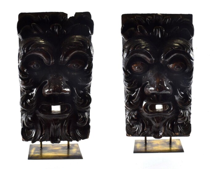 A Pair of Venetian Carved Pine Wall Masks, 18th century, each worked in high relief as a Green Man