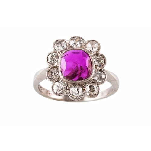 A RUBY AND DIAMOND CLUSTER RING, the cushion cut ruby to an ...