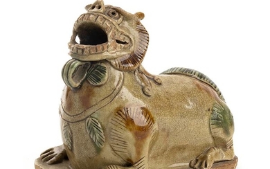 A SANCAI-GLAZED 'CHANGSHA' CERAMIC MODEL OF A BUDDHIST LION China,...