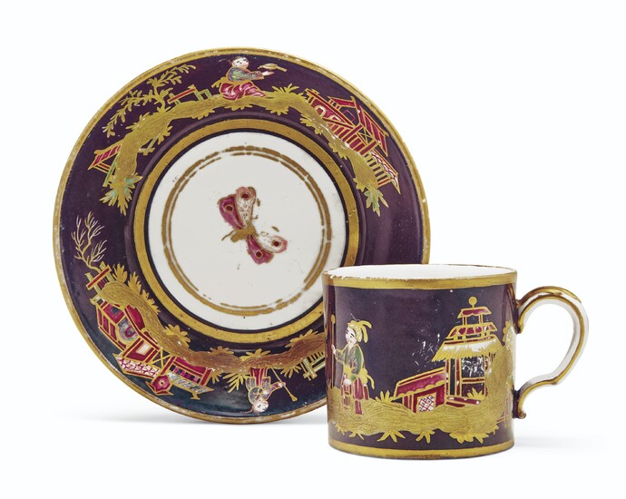 A SEVRES (HARD PASTE) PORCELAIN AUBERGINE-GROUND SMALL CUP AND SAUCER (GOBELET 'LITRON' ET SOUCOUPE, 4EME GRANDEUR), CIRCA 1785, IRON-RED CROWNED INTERLACED L'S MARKS, PROBABLY PAINTED BY DIEU, THE CUP INCISED CP