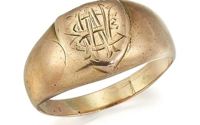 A SIGNET RING, the shield shaped signet ring with broad