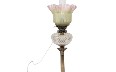 A SILVER PLATED CORINTHIAN COLUMN OIL LAMP with cut glass re...