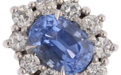 A Sri Lankan 'No Heat' sapphire and diamond oval cluster rin...