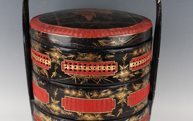 A Straits Chinese black lacquer and red woven cane three-tier wedding basket and cover, late Qing dy