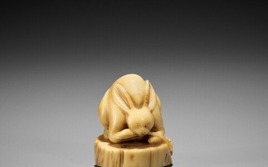 A VERY RARE NARWHAL TUSK NETSUKE OF A RABBIT WITH REISHI