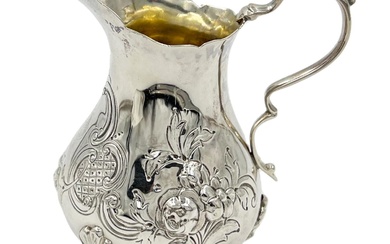 A VICTORIAN SILVER CREAM JUG WITH FLORAL DECORATION, LONDON,...