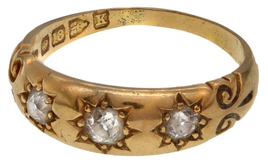 A Victorian Diamond Gypsy Ring The 18K yellow gold band mounted with three round cut diamonds i...