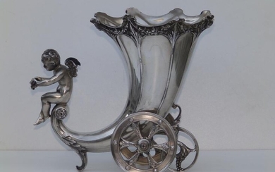 A WMF cornucopia chariot vase, having two revolving wheels...