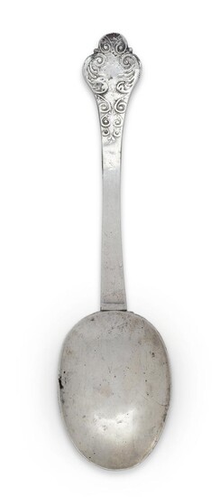 A West Country silver lace-back trefid spoon, Taunton, c.1690, Samuel Dell, prick dot engraved to reverse of terminal with initials IB over AP, 1689, foliate scroll decoration to reverse of bowl and front of terminal, 18.6cm long, approx. weight...