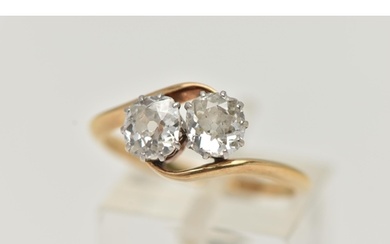 A YELLOW METAL DIAMOND TWO STONE RING, two old cut diamonds...