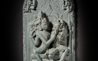 A black stone stele figure depicting Uma-Maheshvara, East India, Pala period, 12th century