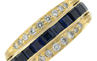A brilliant-cut diamond, emerald and sapphire swivel ring.
