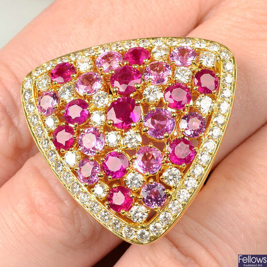 A brilliant-cut diamond, ruby and pink sapphire triangular-shape cocktail ring.