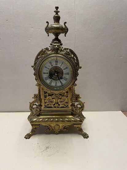 SOLD. A bronze mantel clock, richly cast with rocailles and foliage, enamelled dial. Late 19th century. H. 46. – Bruun Rasmussen Auctioneers of Fine Art