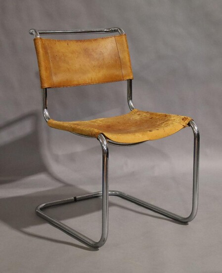 A chrome tubular cantilever chair, mid 20th century, with tan leather seat and backrest