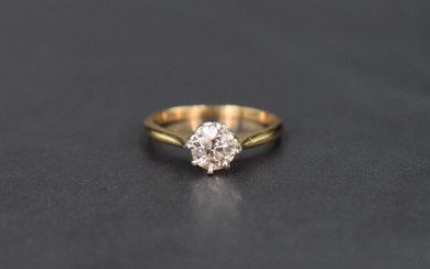 A diamond solitaire ring, approx 0.6ct in a raised claw set mount on a yellow metal loop, no