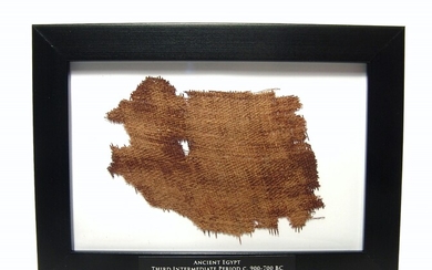 A framed swatch of ancient Egyptian mummy linen