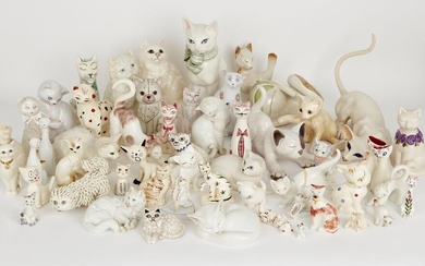 A group of pottery cats with overall cream and white colour way of varying designs and makers to include; a seated cat by Beswick, 22.5cm, a Galos recumbent cat with iridescent glaze, printed with hand-painted marks to base, a Meissen cat with blue...