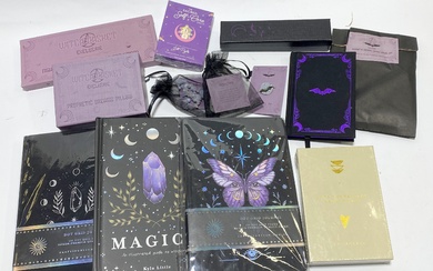 A group of witch themed items including notebooks etc.