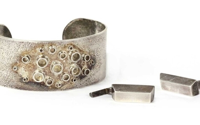 A handmade sterling silver torque bangle