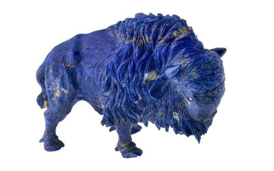 A lapis lazuli figurine, carved as a Bison with naturalistic detail and brilliant-cut diamond eyes, length 18cm height 9.5cm
