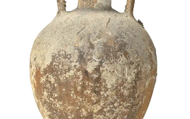 A large Roman pottery transport amphora, 1st-2nd century AD, 60cm. diam. Provenance:...