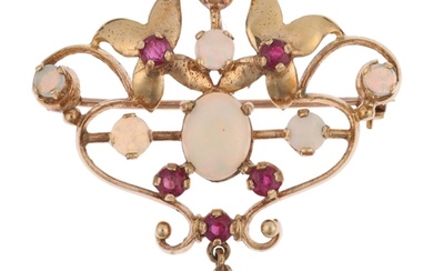 A late 20th century 9ct gold ruby and opal openwork pendant/...