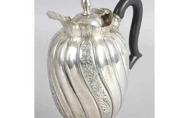 A late Victorian silver lidded jug or ewer, by Walker & Hall.