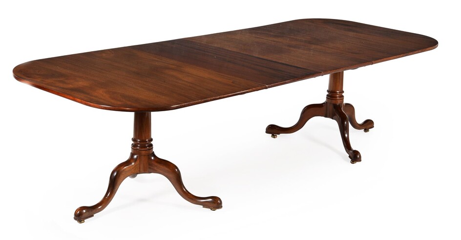 A mahogany twin pedestal dining table in George III style