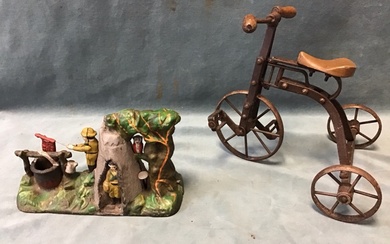 A painted cast iron mechanical boy scout camp moneybox cast...