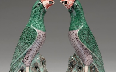 A pair of Chinese glazed biscuit models of parrots, 19th c i...