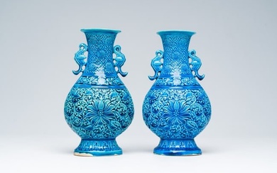 A pair of Chinese turquoise glazed 'lotus' vases, Republic, 20th C.