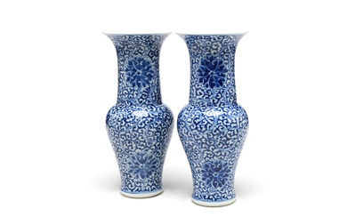 A pair of blue and white porcelain vases painted with stylized scrolling lotus pattern