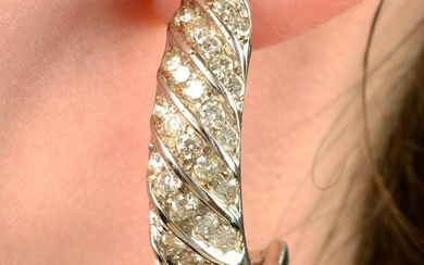 A pair of brilliant-cut diamond spiral half hoop earrings.Estimated total diamond weight 1.75cts