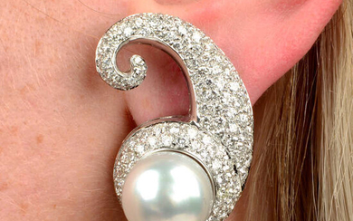 A pair of cultured pearl and pavé-set diamond scroll earrings.