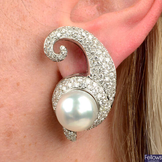 A pair of cultured pearl and pavé-set diamond scroll earrings.